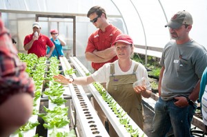 farm school participants in greenhouse