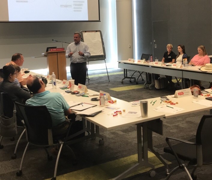 Gary Bullen teaching farm school participants