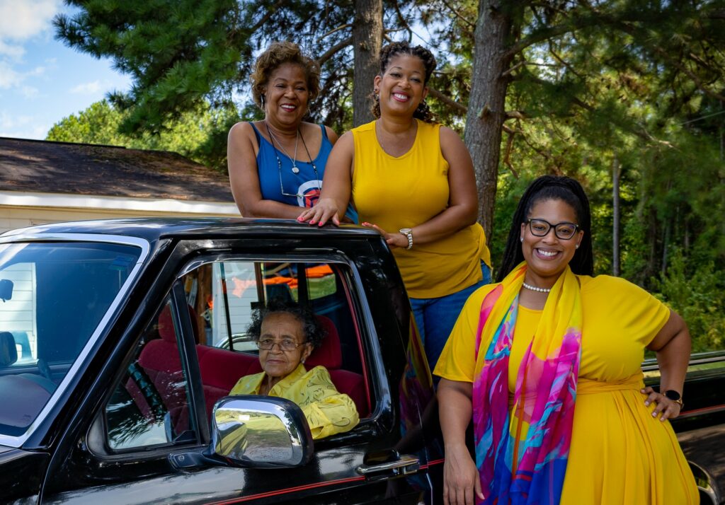 4 women smiling at camera