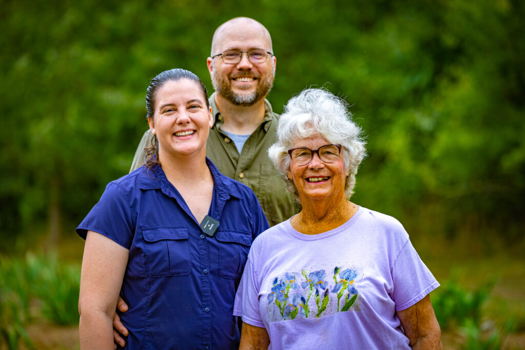 3 people smiling at camera